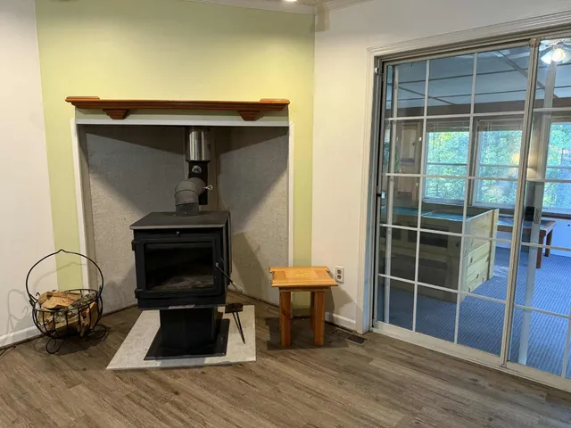 a view of a patio with a table and chairs