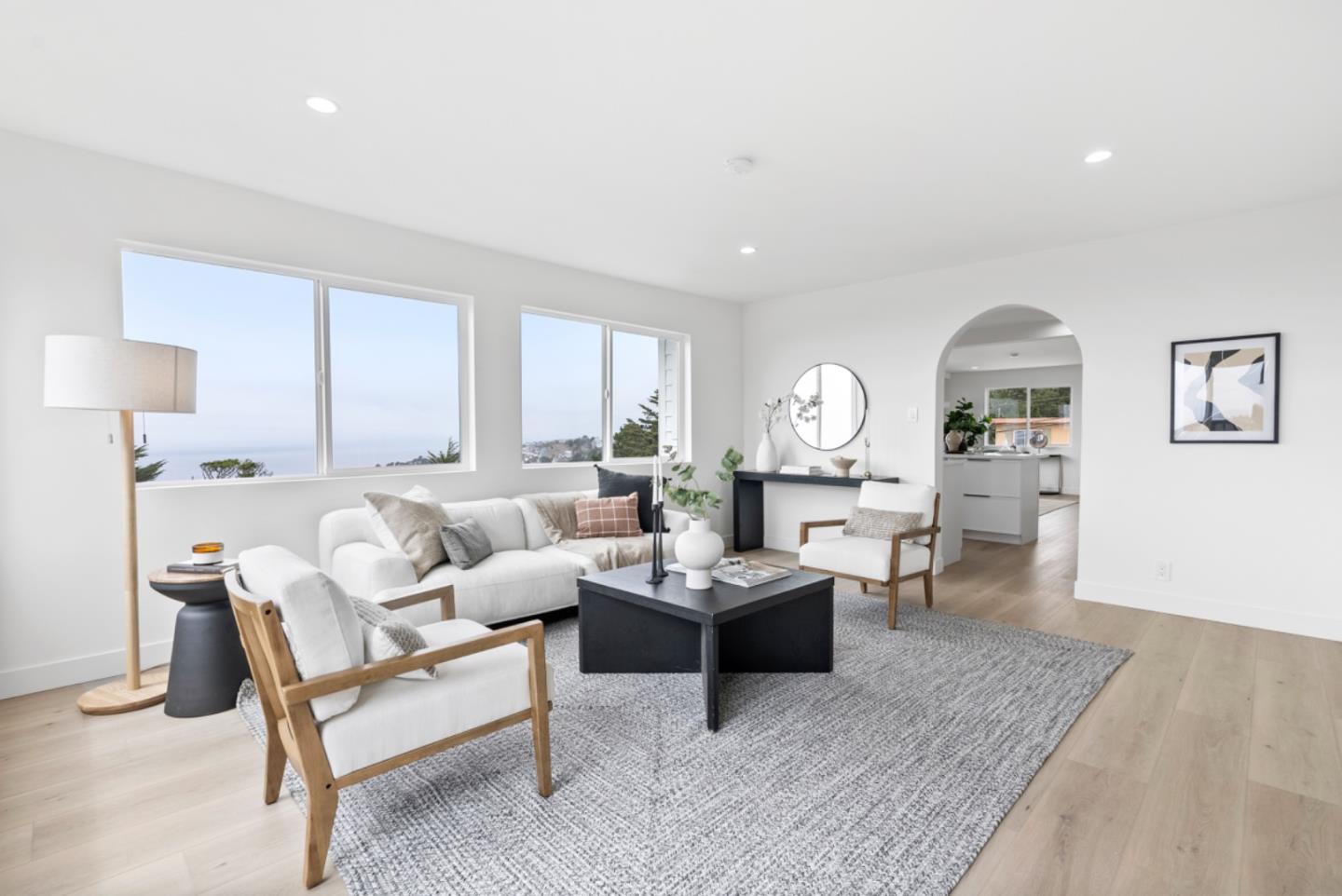 444 Manor Drive Pacifica, CA 94044 - Photo 13 of 70 a living room with furniture a rug and a lamp