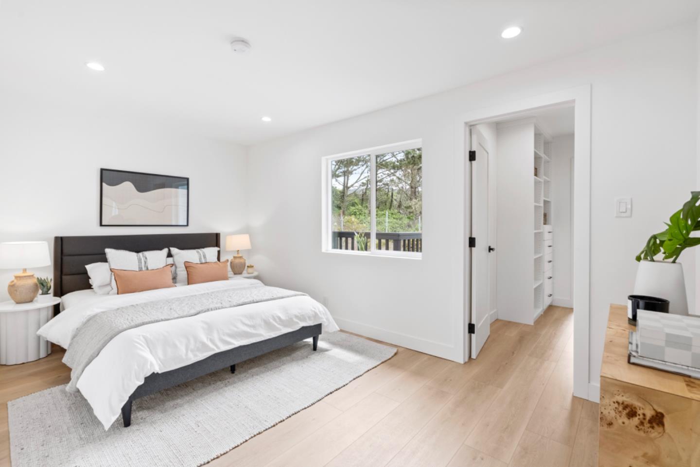 444 Manor Drive Pacifica, CA 94044 - Photo 17 of 70 a bedroom with a bed and a potted plant on the dresser