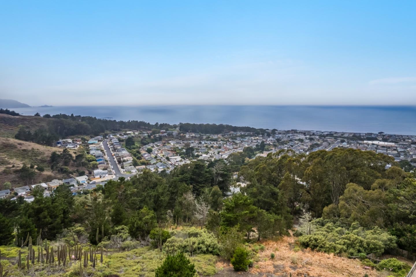 444 Manor Drive Pacifica, CA 94044 - Photo 2 of 70 an aerial view of residential building and trees around