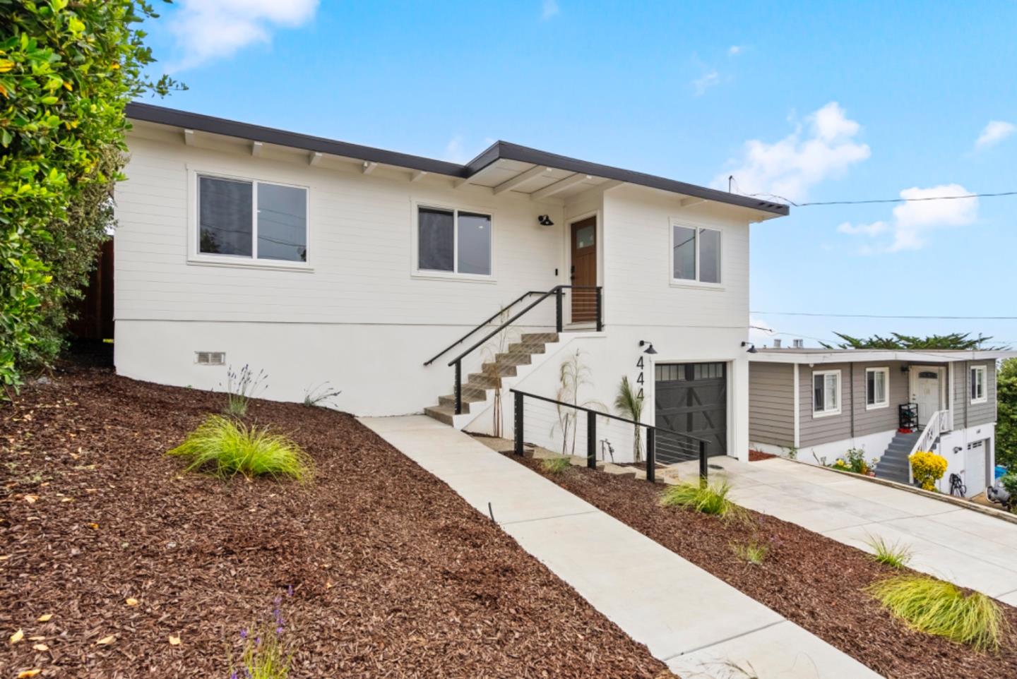 444 Manor Drive Pacifica, CA 94044 - Photo 30 of 70 a view of a house with backyard and sitting area