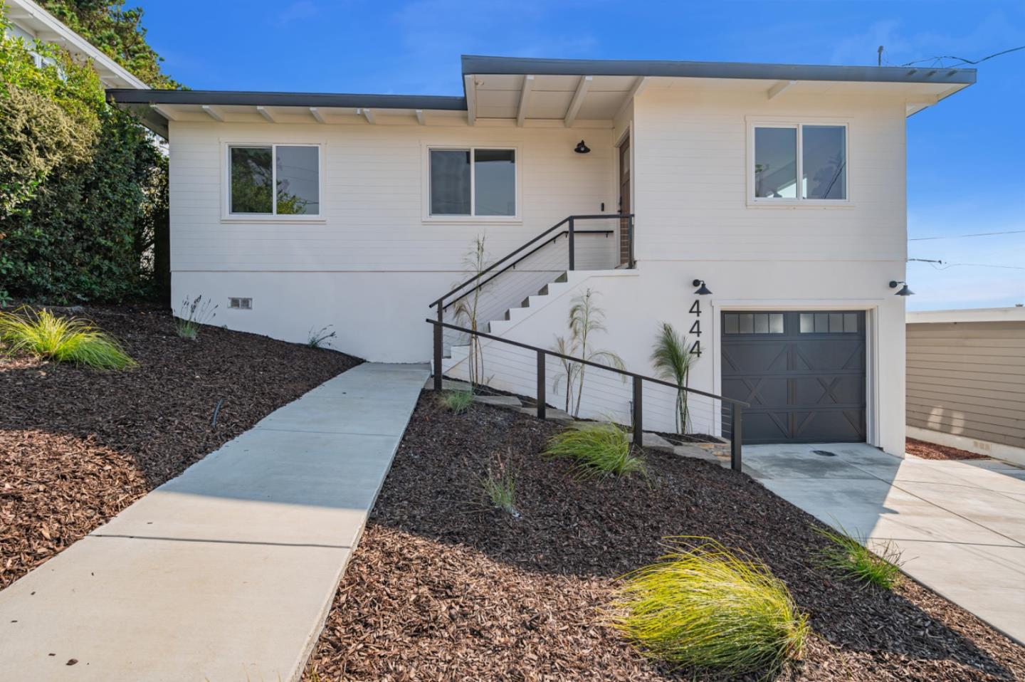 444 Manor Drive Pacifica, CA 94044 - Photo 42 of 70 a view of a house with backyard and sitting area