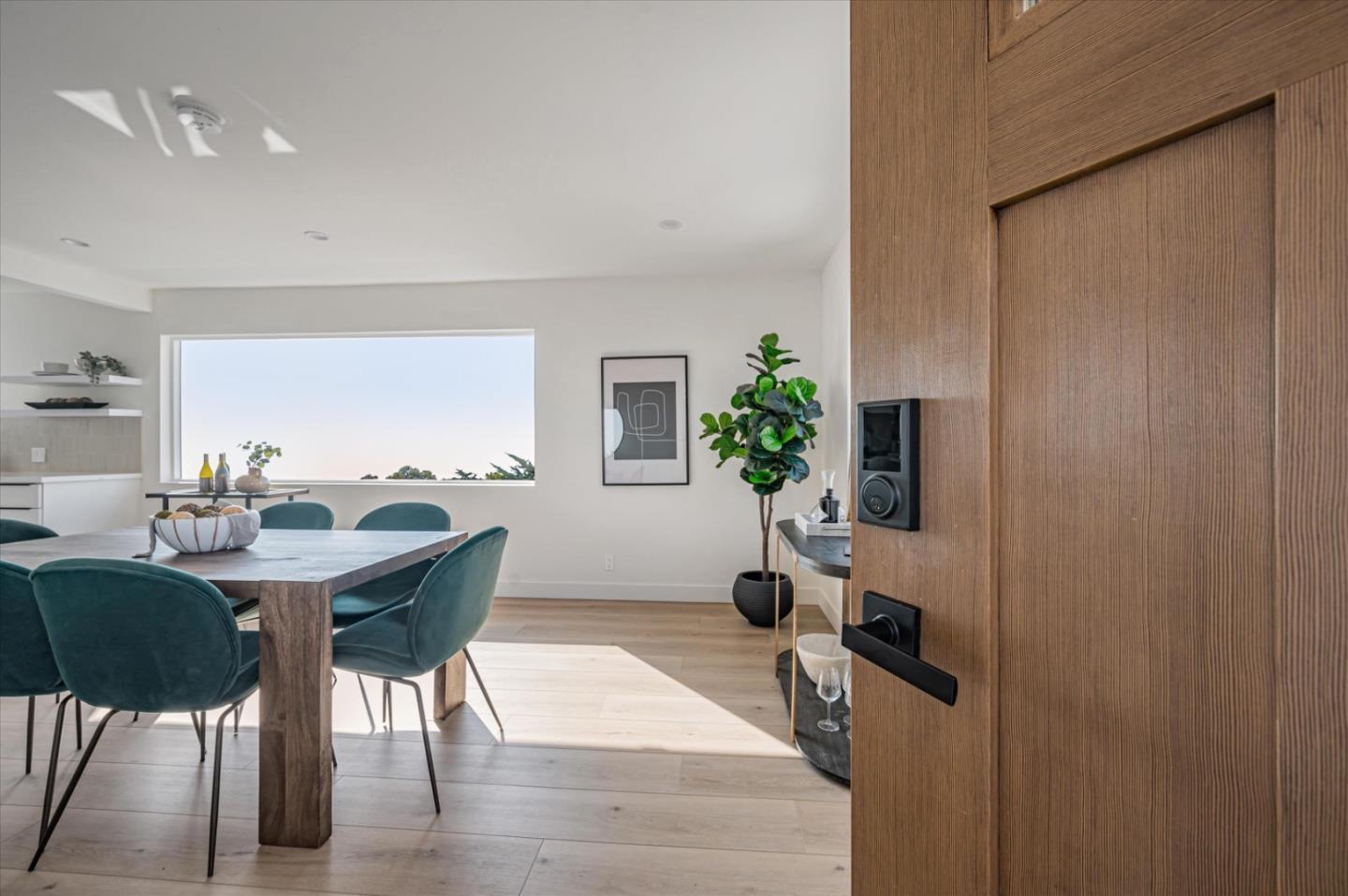 444 Manor Drive Pacifica, CA 94044 - Photo 45 of 70 a view of a dining room with furniture and a potted plant