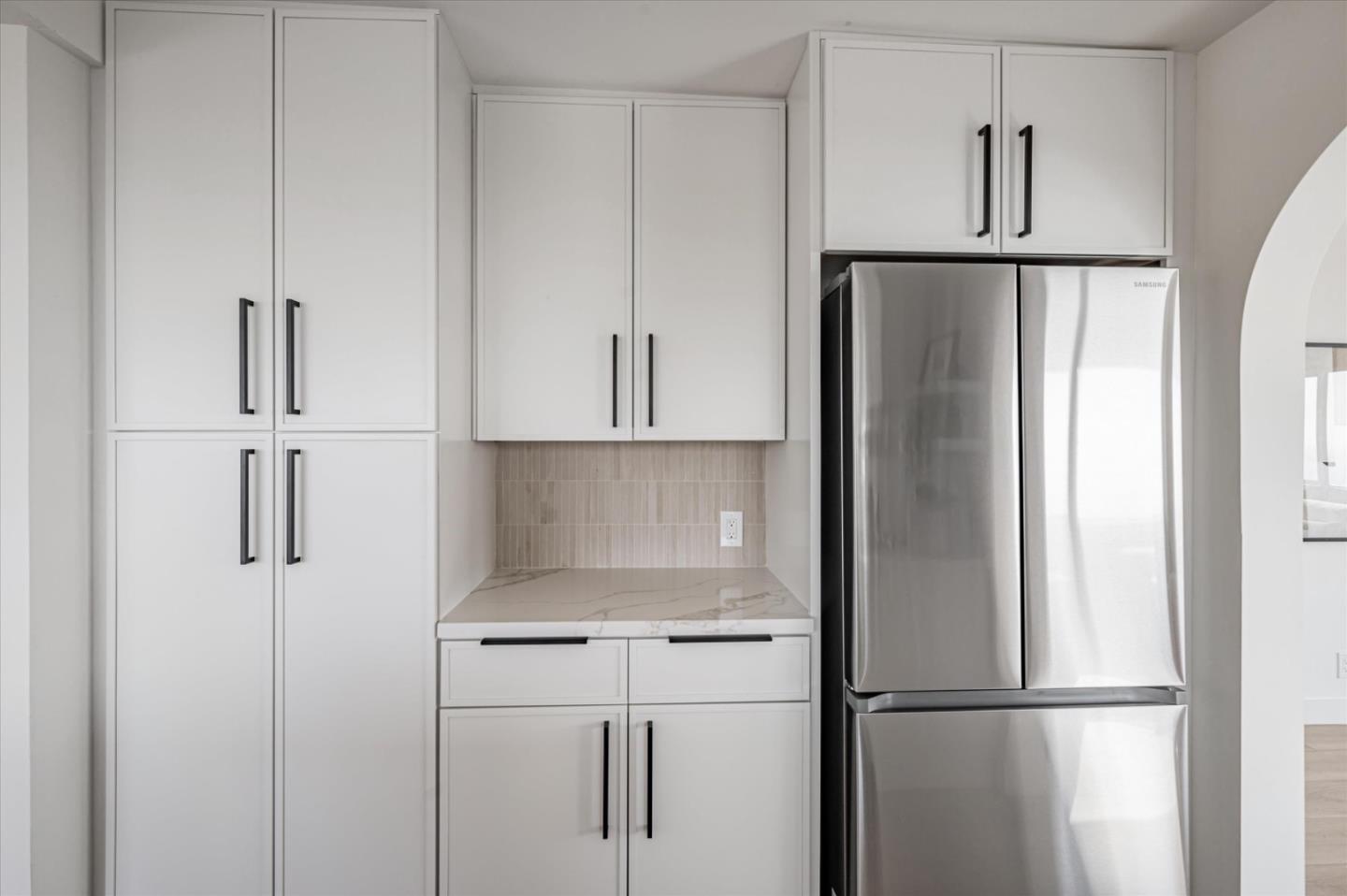 444 Manor Drive Pacifica, CA 94044 - Photo 52 of 70 a kitchen with white cabinets and refrigerator