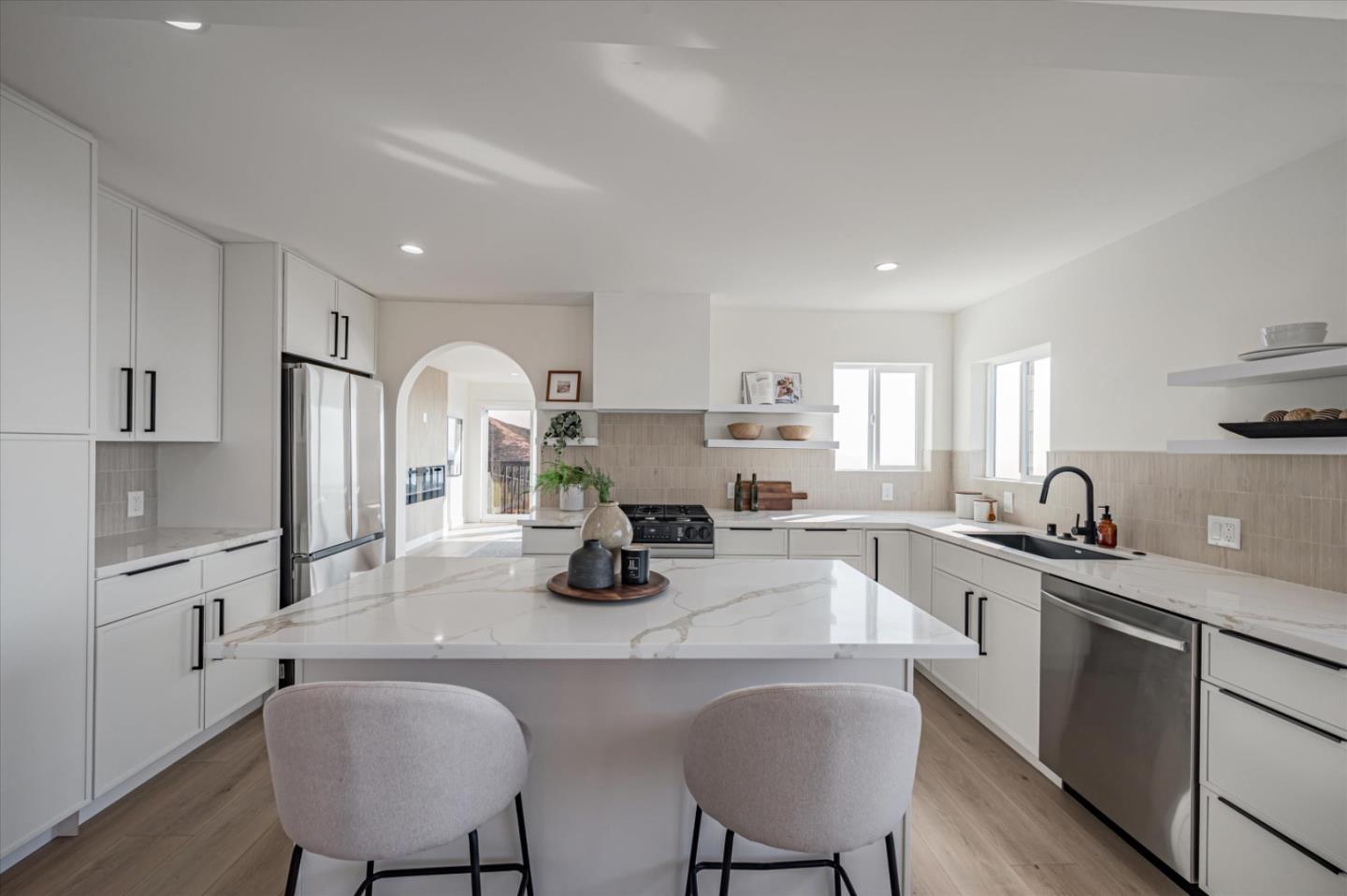 444 Manor Drive Pacifica, CA 94044 - Photo 55 of 70 a kitchen with stainless steel appliances granite countertop a sink a stove a refrigerator cabinets and chairs