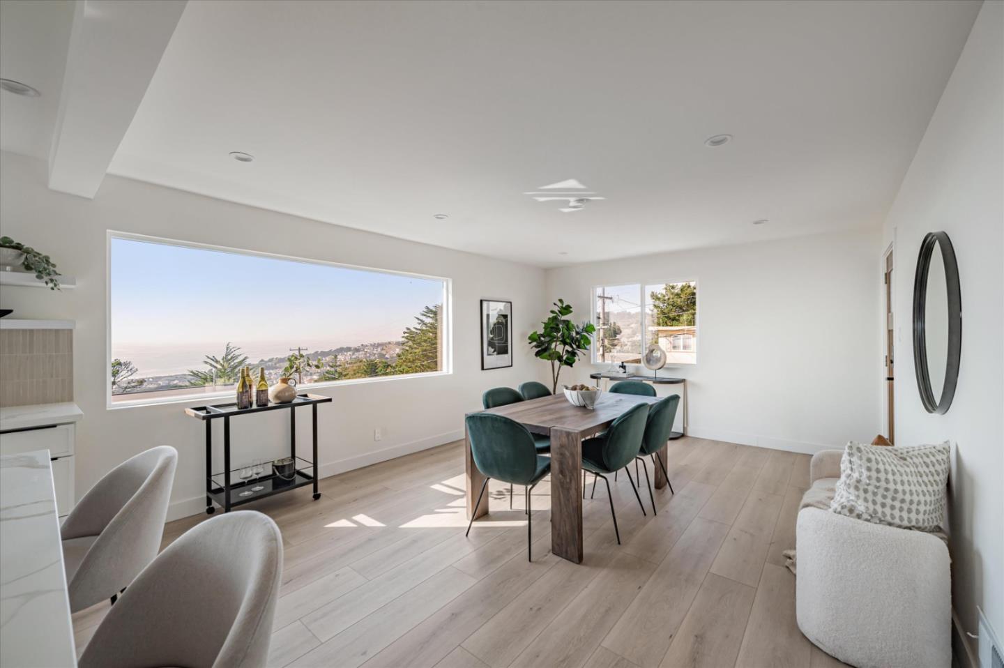 444 Manor Drive Pacifica, CA 94044 - Photo 59 of 70 a view of a dining room with furniture and wooden floor