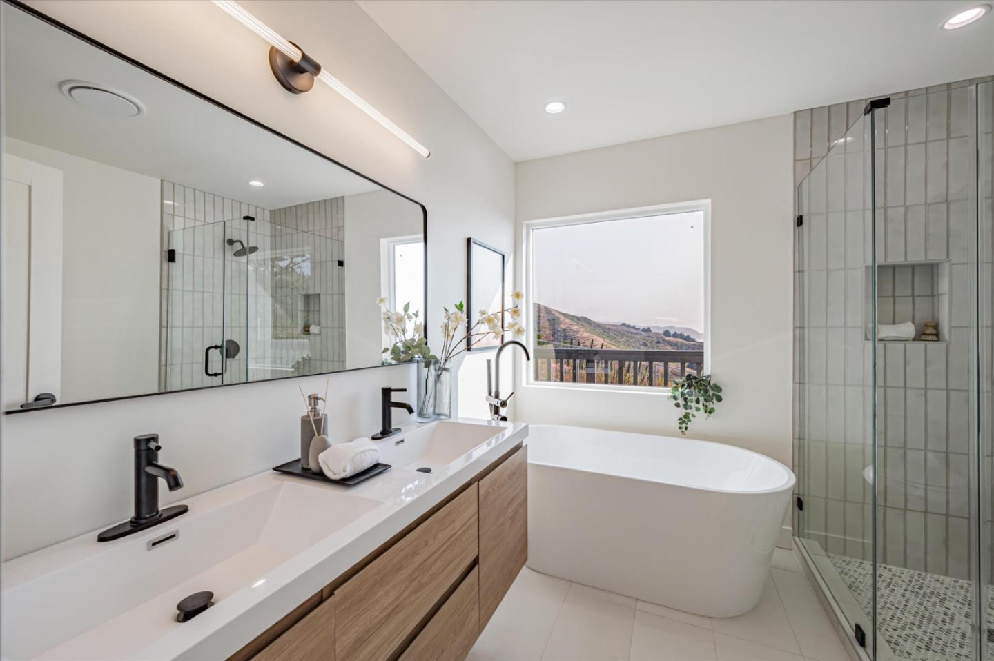 444 Manor Drive Pacifica, CA 94044 - Photo 61 of 70 a bathroom with a tub a sink and a shower