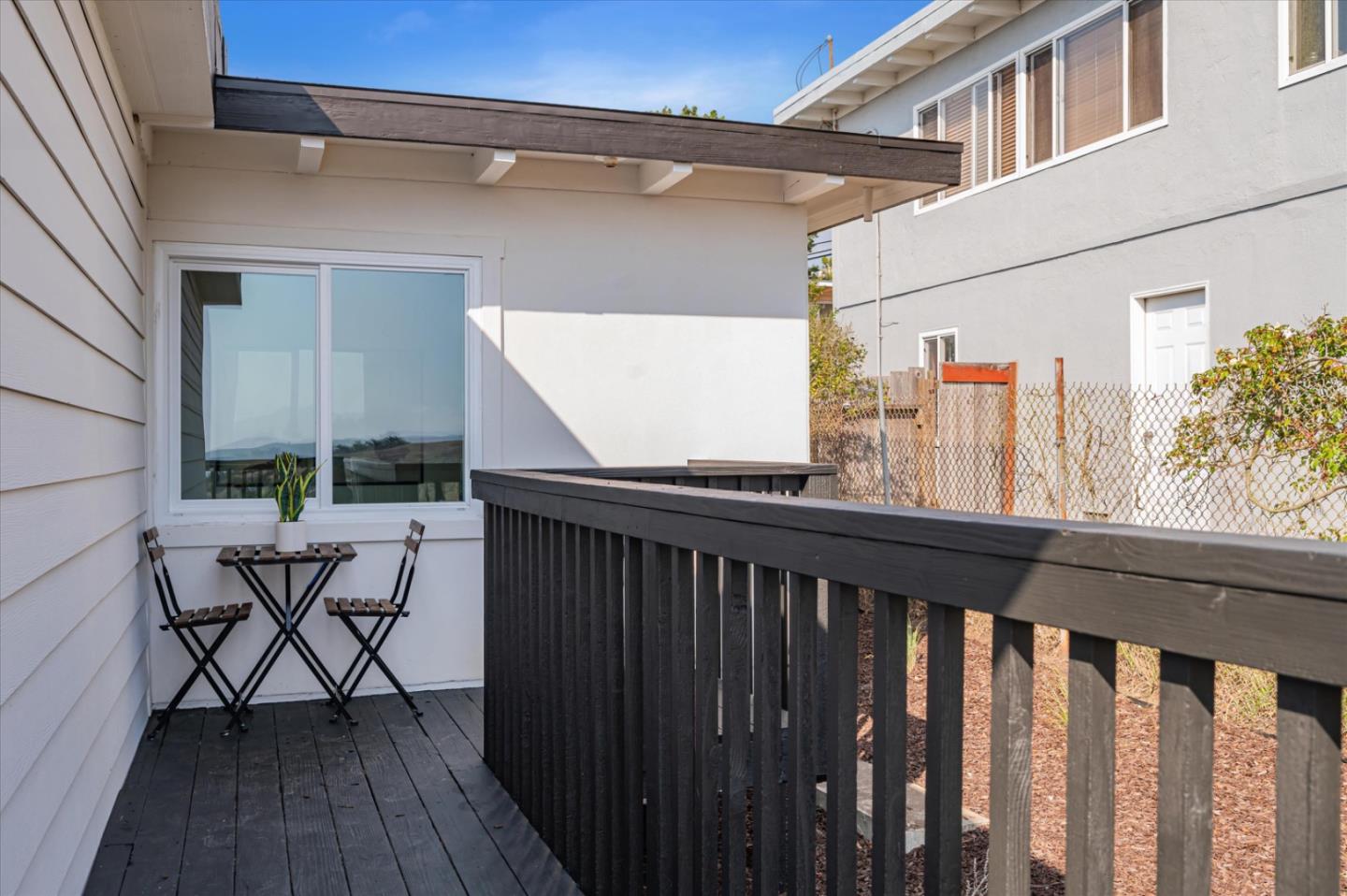 444 Manor Drive Pacifica, CA 94044 - Photo 64 of 70 a balcony view with two chairs and a table