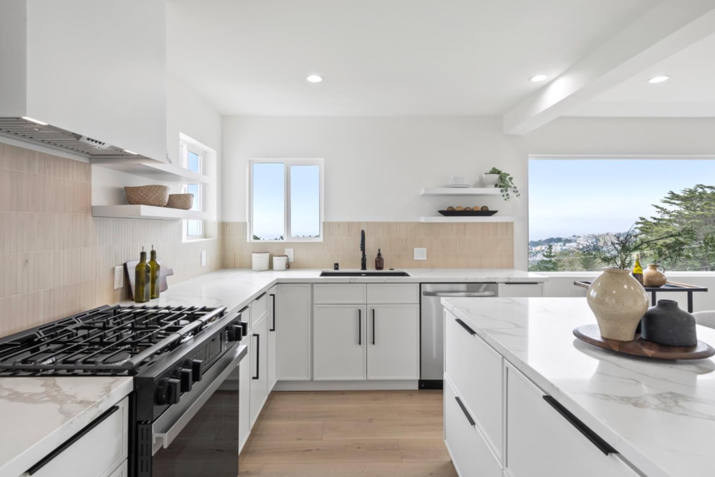 444 Manor Drive Pacifica, CA 94044 - Photo 8 of 70 a kitchen with a sink stove and cabinets