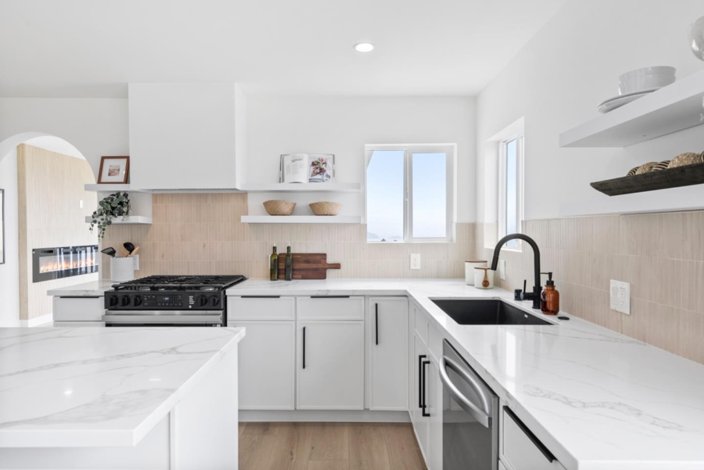 444 Manor Drive Pacifica, CA 94044 - Photo 10 of 70 a kitchen with a sink dishwasher a stove and a refrigerator with wooden cabinets