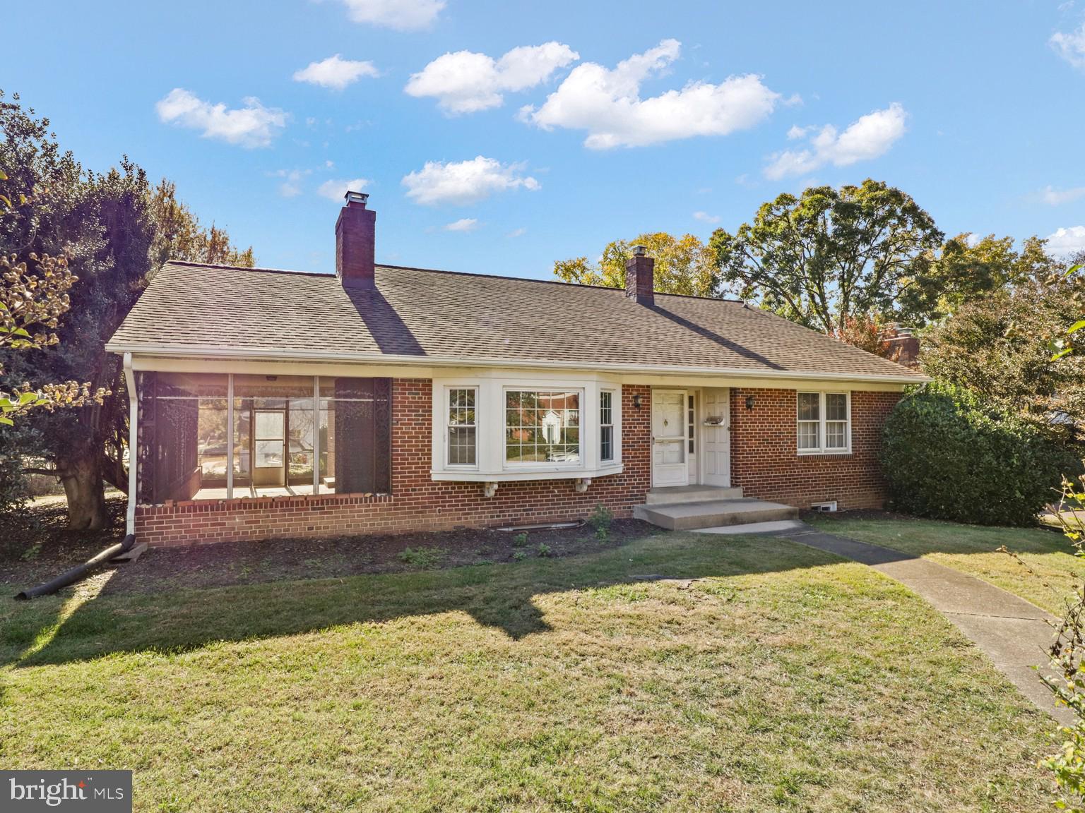1002 Beverley Drive Alexandria, VA 22302 - Photo 1 of 46 a front view of a house with a yard