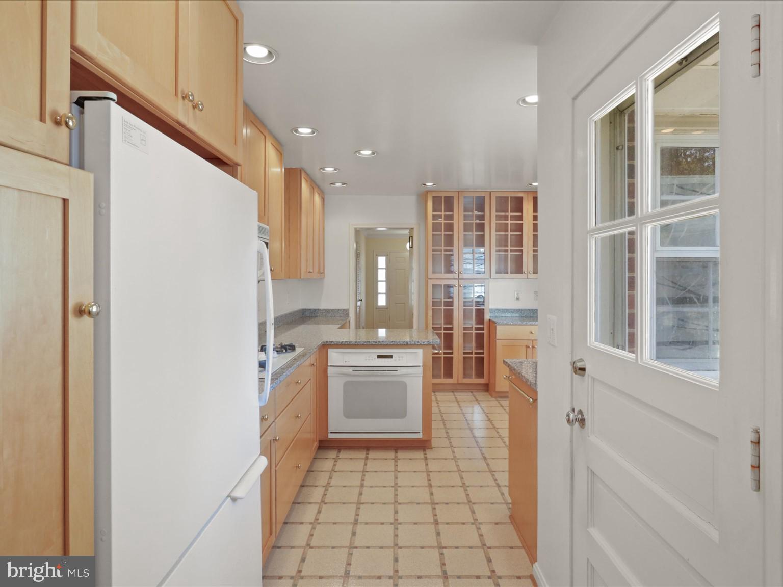 1002 Beverley Drive Alexandria, VA 22302 - Photo 14 of 46 a kitchen with a refrigerator and a sink