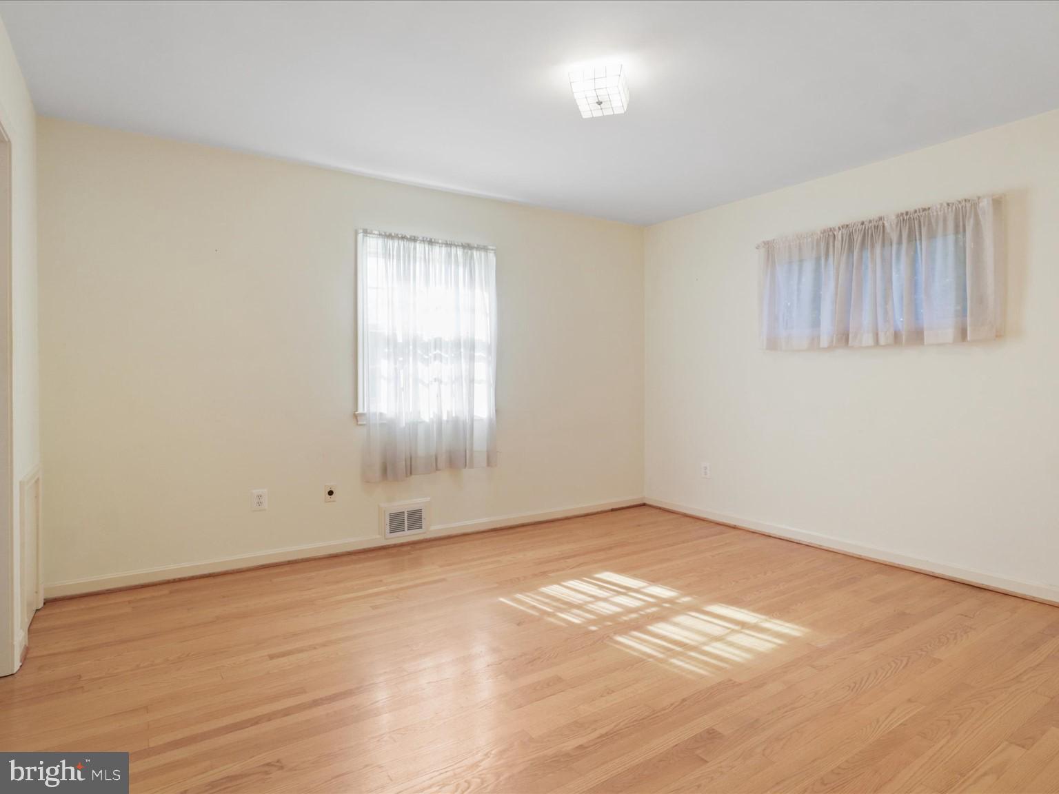 1002 Beverley Drive Alexandria, VA 22302 - Photo 20 of 46 an empty room with cabinet and windows