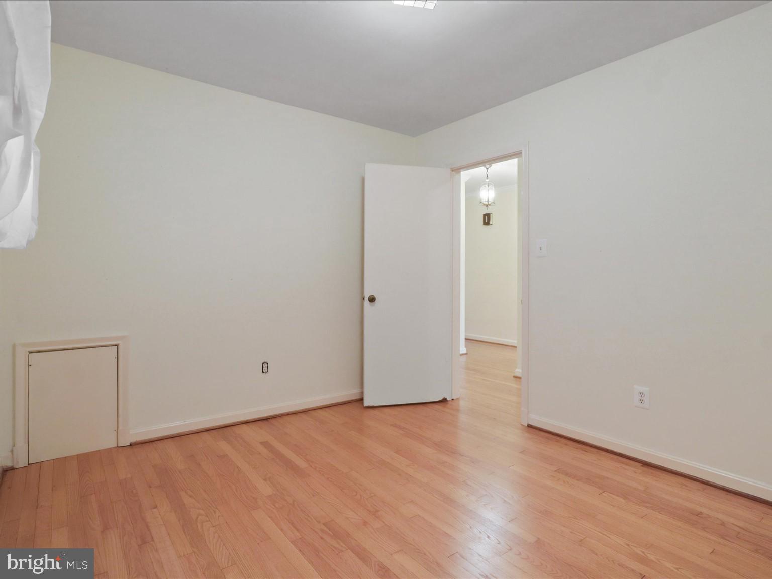 1002 Beverley Drive Alexandria, VA 22302 - Photo 22 of 46 an empty room with wooden floor and closet