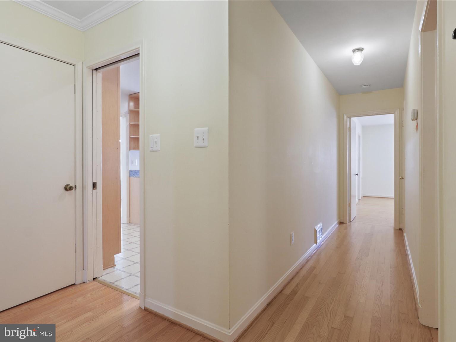 1002 Beverley Drive Alexandria, VA 22302 - Photo 24 of 46 a view of a hallway with wooden floor