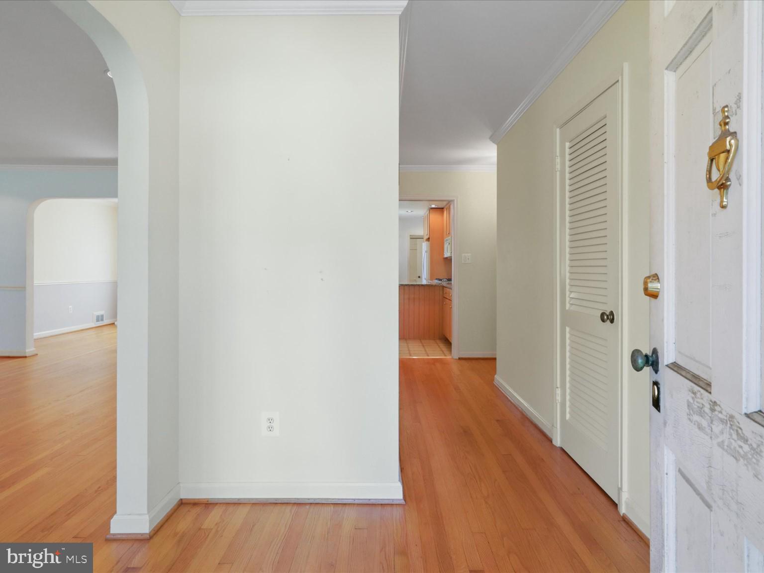 1002 Beverley Drive Alexandria, VA 22302 - Photo 27 of 46 a view of a hallway with wooden floor and closet