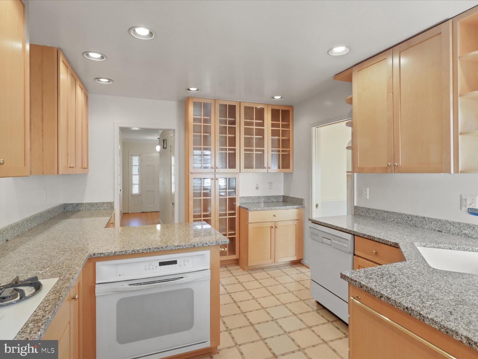 1002 Beverley Drive Alexandria, VA 22302 - Photo 9 of 46 a kitchen with a stove a sink and a refrigerator
