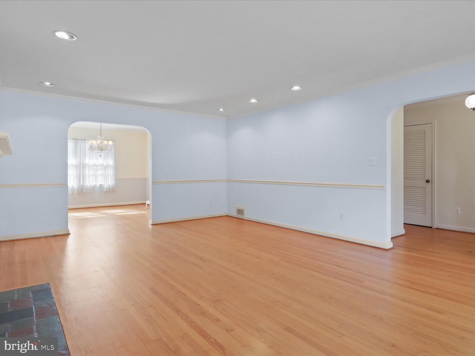 1002 Beverley Drive Alexandria, VA 22302 - Photo 10 of 46 a view of an empty room with wooden floor and a window