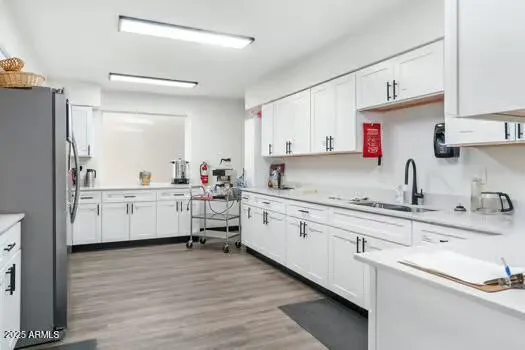a kitchen with sink cabinets and window