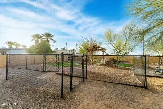 a view of outdoor space with iron fence