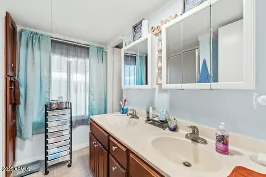 a bathroom with a sink and a mirror