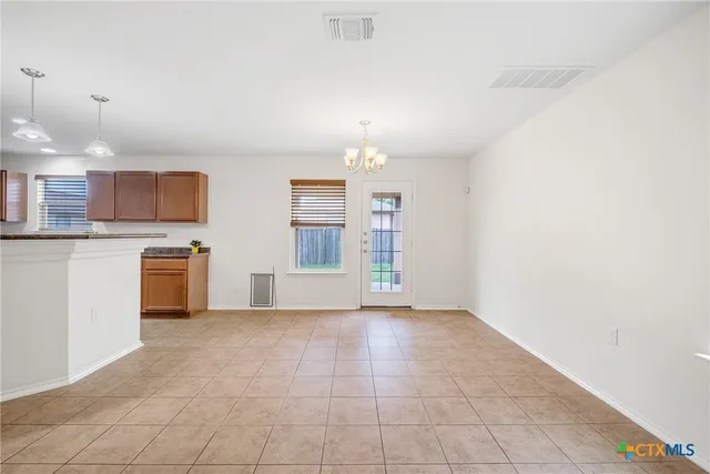 a view of a kitchen with a sink and a microwave
