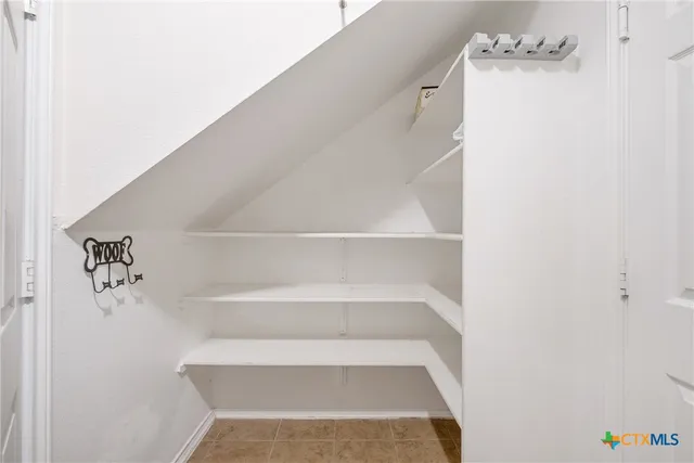 a view of staircase with white walls