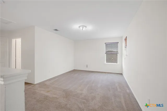 a view of a room that has a window in it