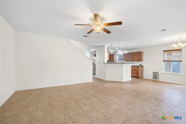 a view of a kitchen with a microwave and cabinets