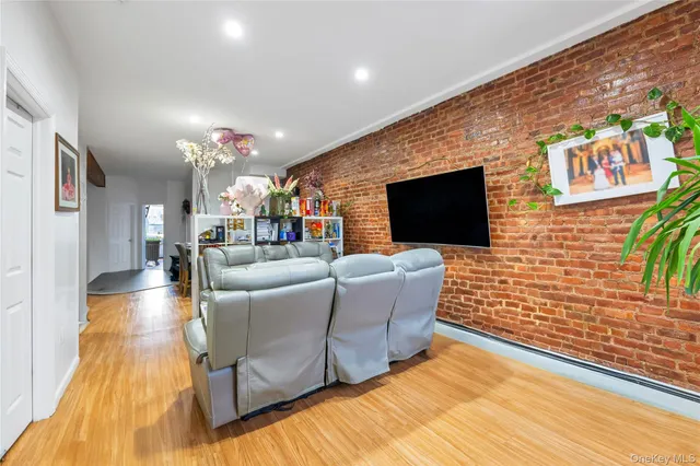 a living room with fireplace furniture and a flat screen tv
