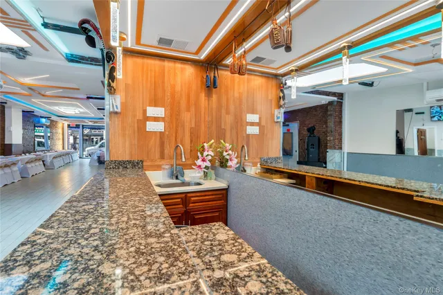 a living room with furniture rug and a large window