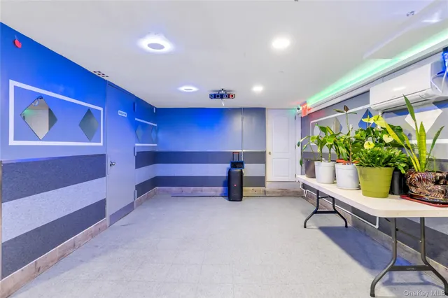 a room with wooden floor and furniture