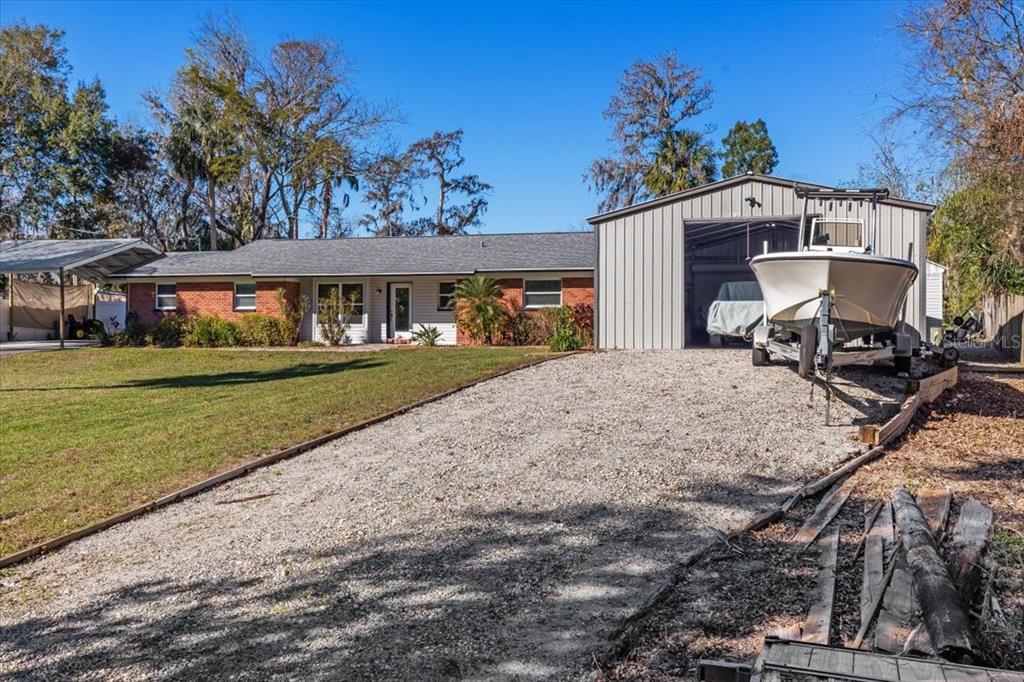 7226 Alafia Ridge Loop Riverview, FL 33569 - Photo 6 of 51 a front view of a house with a yard