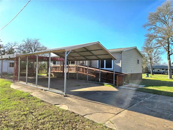 a view of a house with swimming pool and yard
