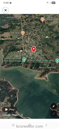 a aerial view of a house with a yard