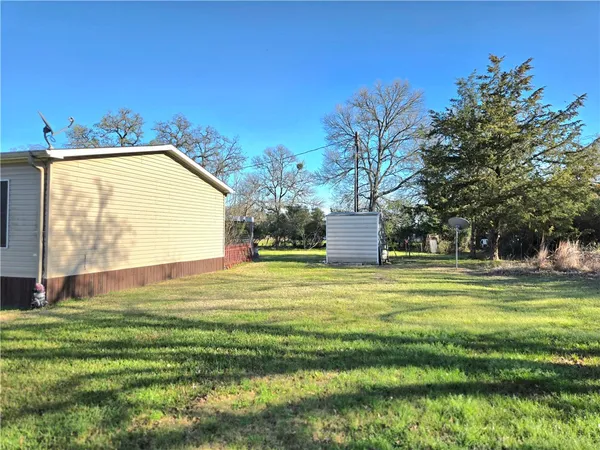 a view of a swimming pool with a house in the background