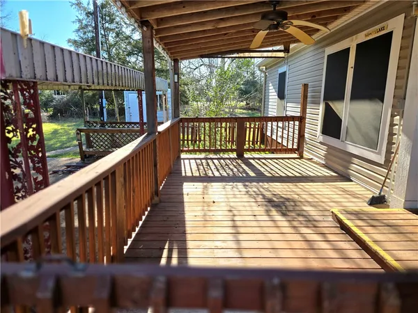 a view of a balcony with wooden floor