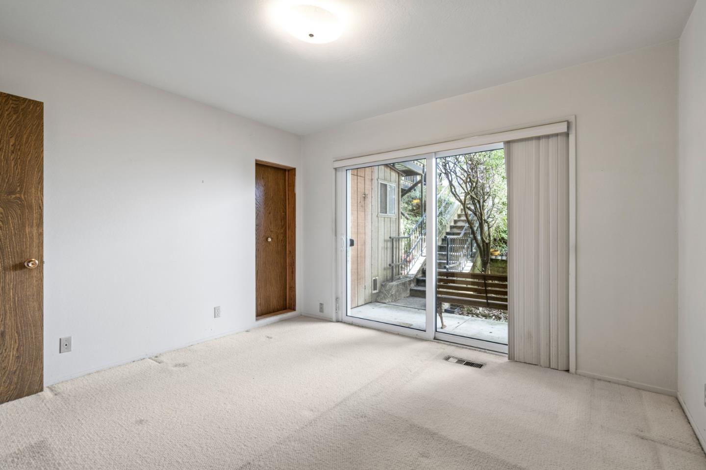 24 Perego Terrace San Francisco, CA 94131 - Photo 3 of 7 an empty room with floor to ceiling window and an outdoor view