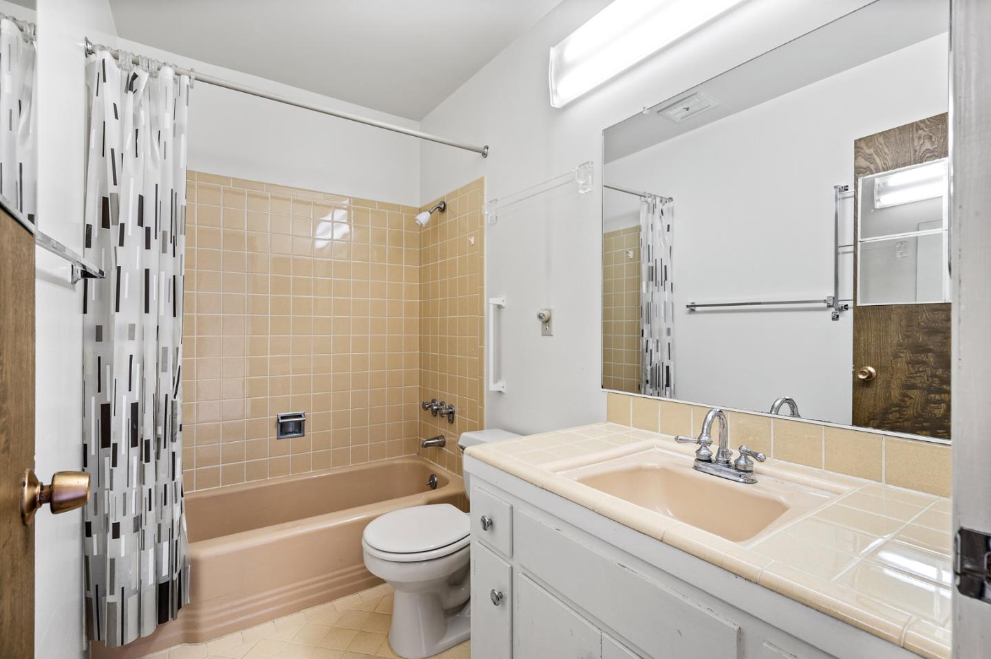 24 Perego Terrace San Francisco, CA 94131 - Photo 5 of 7 a bathroom with a sink a toilet and shower