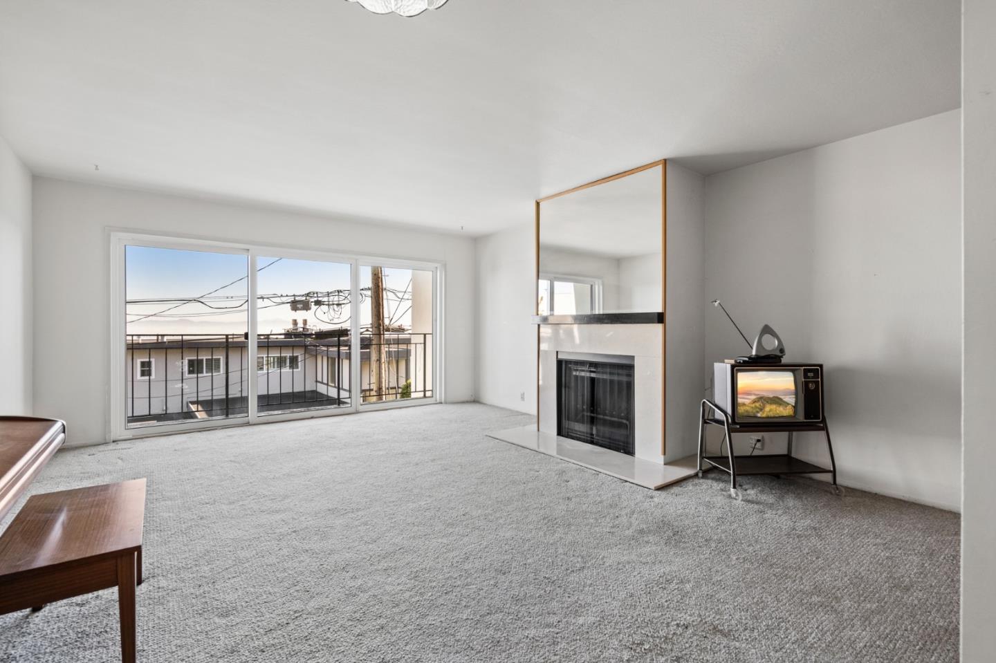 24 Perego Terrace San Francisco, CA 94131 - Photo 6 of 7 a view of a livingroom with a fireplace and window