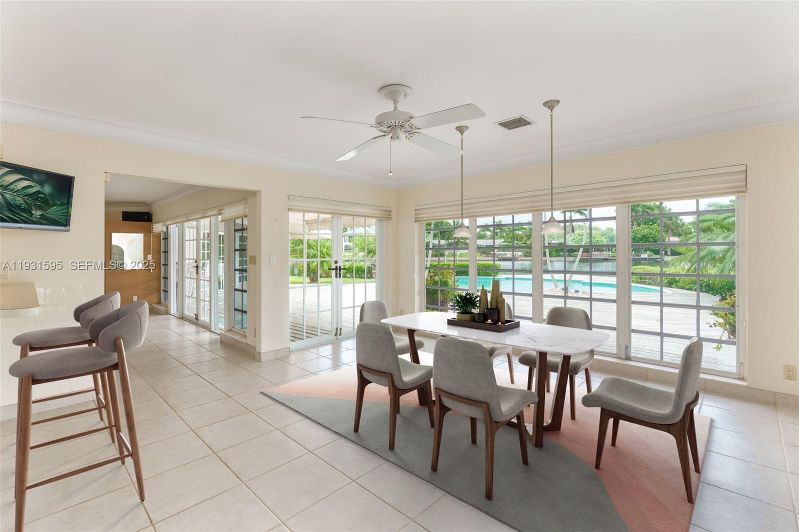2130 Northeast 15th Street Fort Lauderdale, FL 33304 - Photo 13 of 32 a view of a dining room with furniture window and outside view