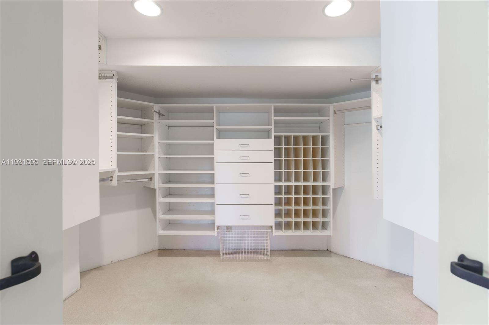 2130 Northeast 15th Street Fort Lauderdale, FL 33304 - Photo 18 of 32 a view of walk in closet with empty racks