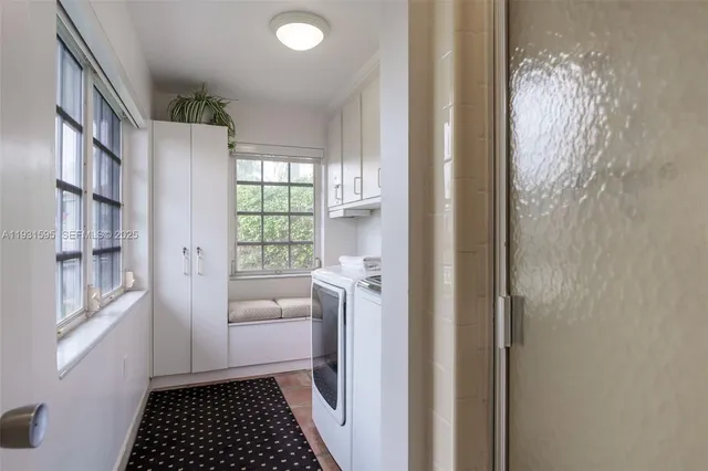 a room with a window and a white door