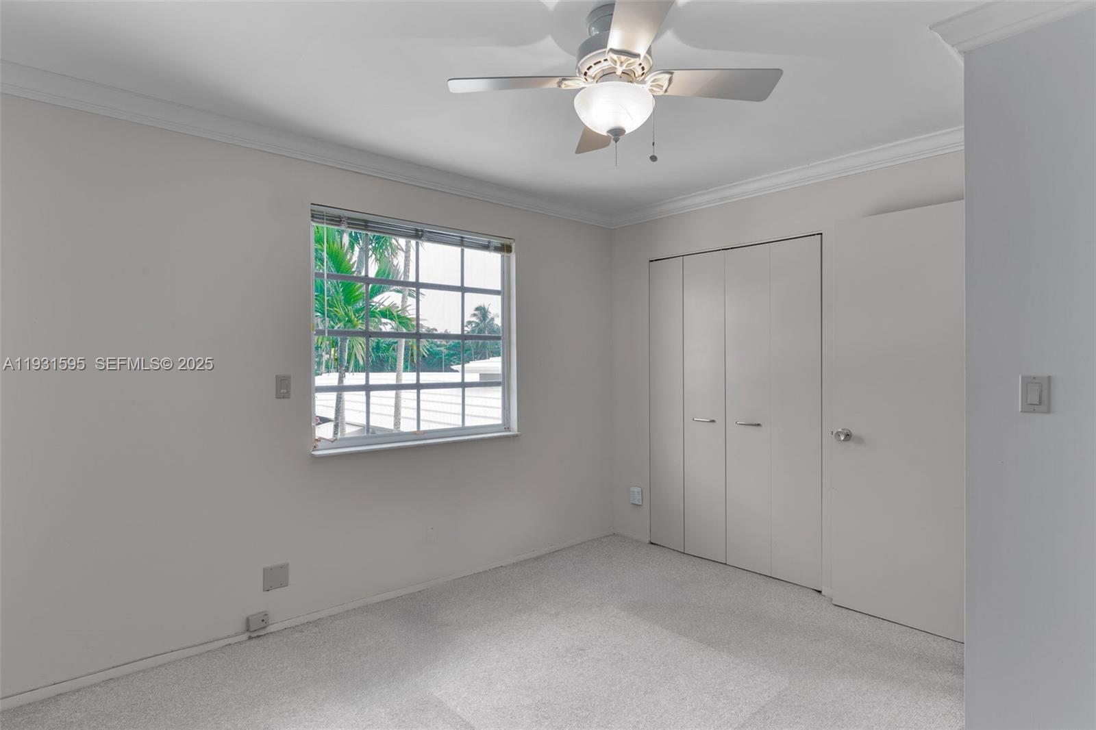 2130 Northeast 15th Street Fort Lauderdale, FL 33304 - Photo 27 of 32 an empty room with a window and a fan