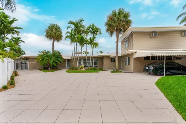 a house with palm tree in front of it
