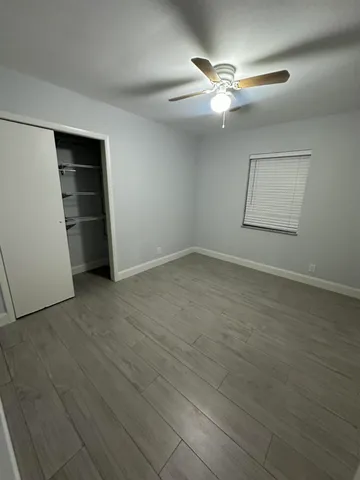 an empty room with closet and closet