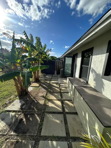 a view of a backyard with sitting area