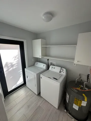 a utility room with dryer and washer