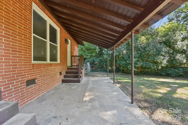 a backyard of a house with lots of green space