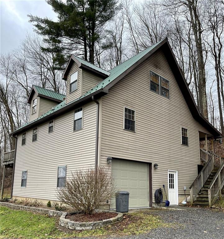 34030 State Rte 27 Guys Mills, PA 16327 - Photo 3 of 21 a view of a house with a yard